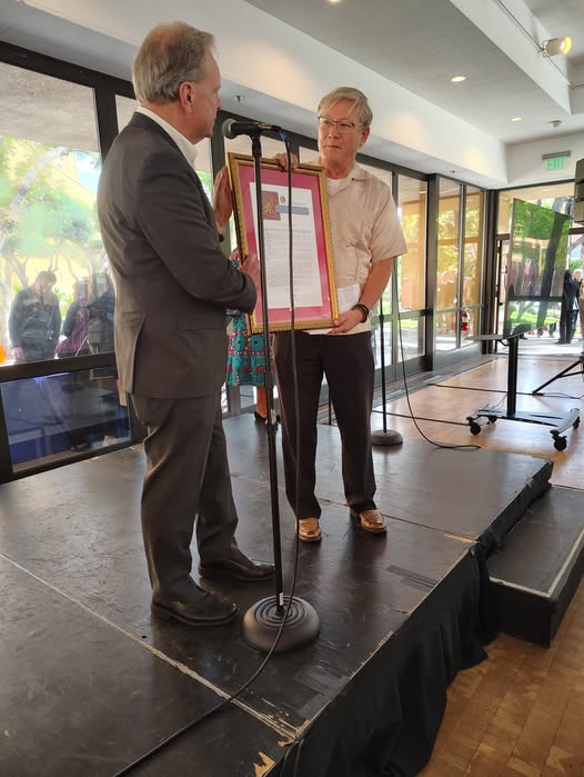 : Senator Cortese presenting a Senate Resolution to Father Jon Pedigo