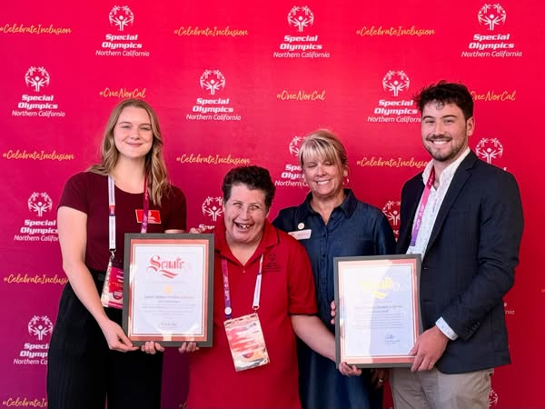 Staffer presenting Senate Certificates to leaders of Special Olympics Northern California