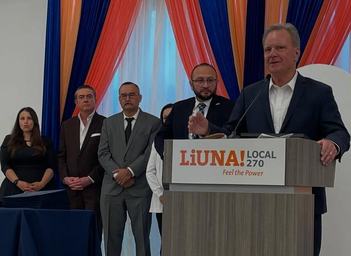 Senator Dave Cortese speaking at a podium with the scholarship committee of Local 270.