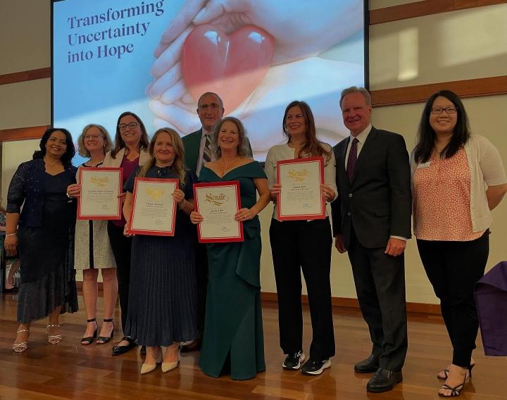 Senator Dave Cortese pictured alongside eight community members with four Senate certificates in hand.