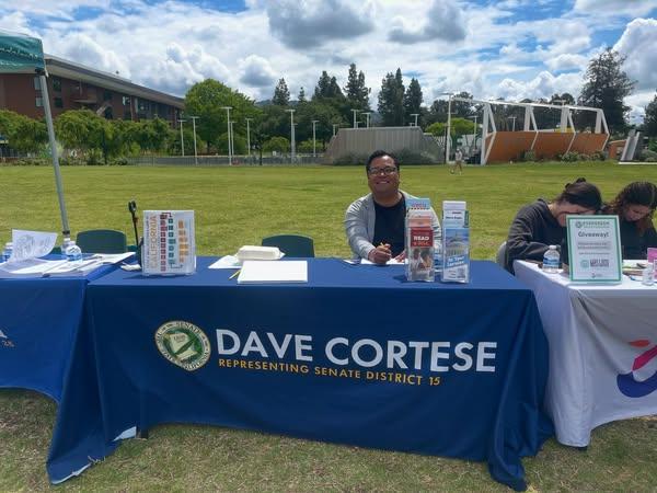 Staff member tabling at Evergreen Valley College Community Day