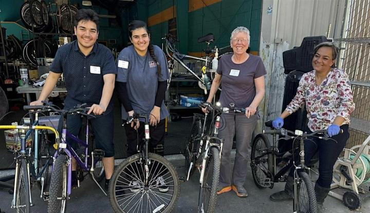 Image of volunteers with bikes at previous event. 