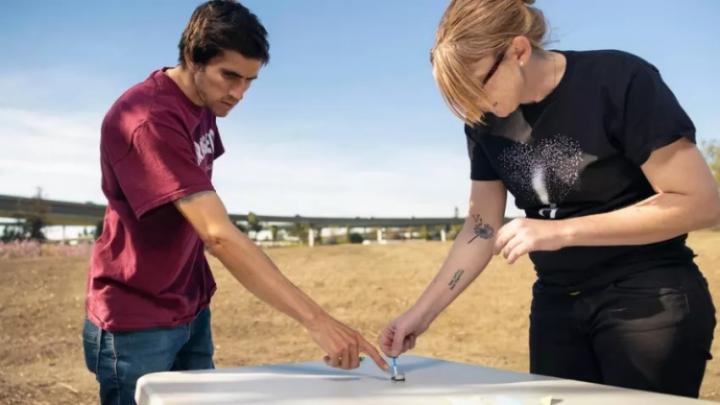 Image of two community members in discussion