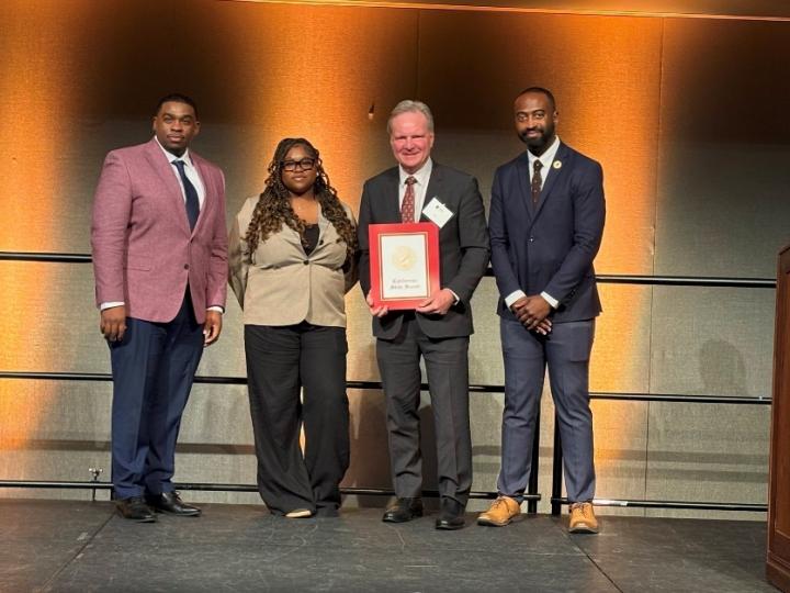 Senator Cortese presenting a certificate of recognition to African American Community Service Agency leadership, including Executive Director Milan Balinton