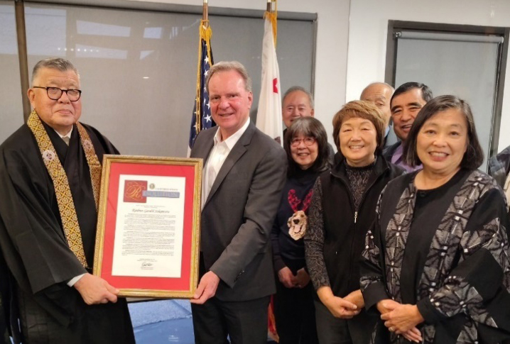 Senator Cortese presenting a Senate Resolution to Rinban Gerald Sakamoto alongside members of the SJ Buddhist Church
