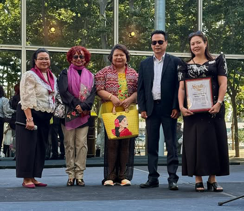 District Representative Phuong Nguyen presenting a Senate certificate to community leaders at the Philippine Independence Day event