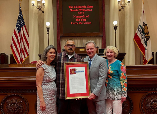 Senator Cortese presenting a resolution alongside Pattie Cortese, Mark Ashford, and Ann Fisher. 