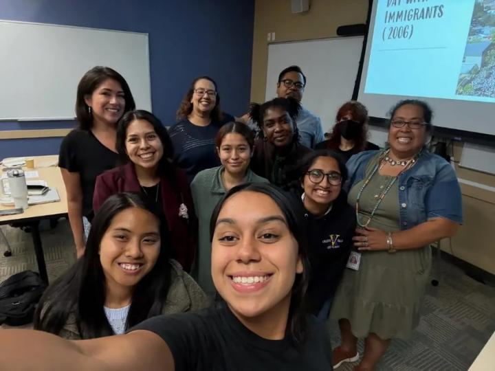 Staffer Mario Lopez photographed with members of the New American Fellowship Program