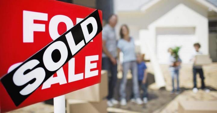 Photograph of a sold “For Sale” sign