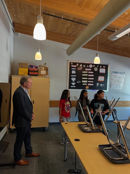 Senator Cortese photographed at tour, alongside three fifth graders