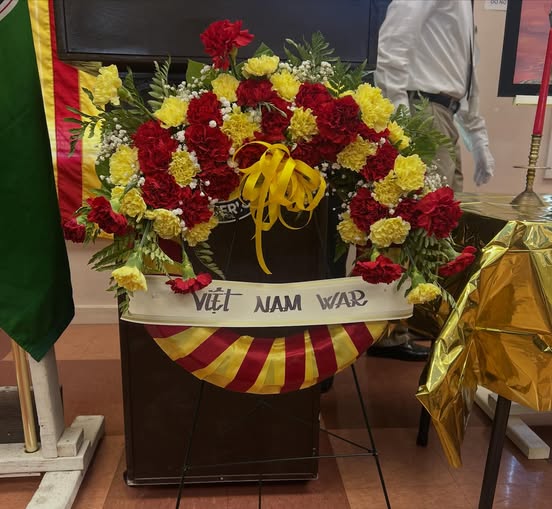 Photograph of wreath with writing, reading “Viet Nam War”