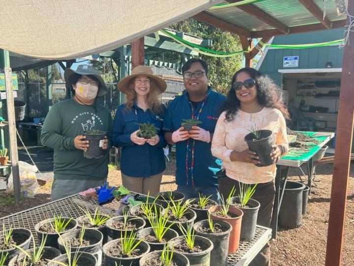 My staff, Mario Lopez, planting trees with Rhonda Berry and community volunteers