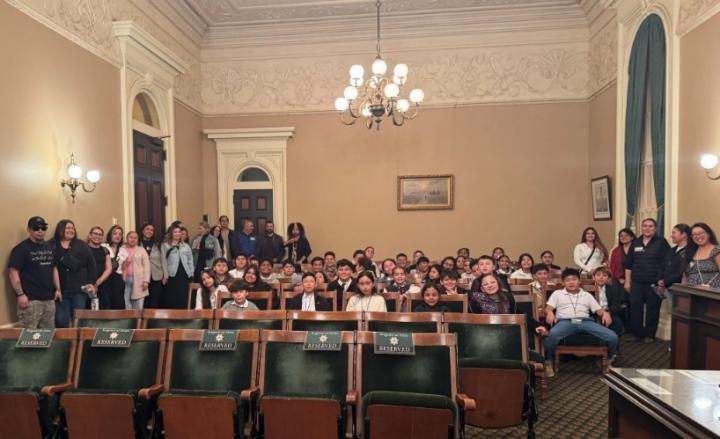 Adelante II Dual Language Academy students pictured seated in the Capitol Building