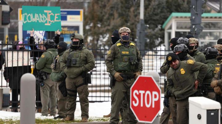 Photograph of immigration enforcement agents