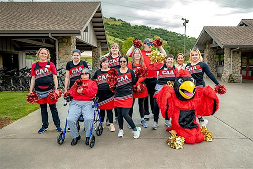 Photograph of CAA students and cheerleaders